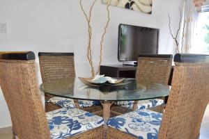 A television and/or entertainment centre at 3BR Apt @CadaquesCaribe Bayahibe