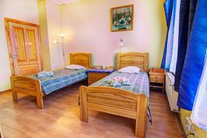 Postel nebo postele na pokoji v ubytování Hotel Luiize