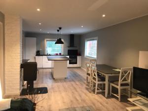 a kitchen and living room with a table and chairs at # 1 Mountain View with free street parking in Bergen