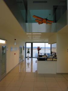 a plane is hanging from the ceiling of a building at Elmontex Air in Mošnov