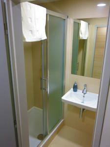a bathroom with a shower and a sink at Elmontex Air in Mošnov