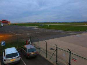 two cars parked in a parking lot at an airport at Elmontex Air in Mošnov