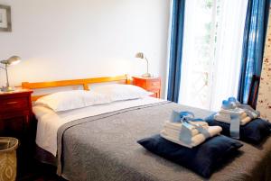 a bedroom with a bed with towels on it at Beachfront Apartment Mala Tereza in Split