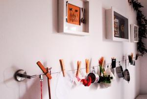 a wall with a bunch of clothes hooks on a wall at Beachfront Apartment Mala Tereza in Split