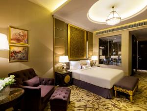 Kama o mga kama sa kuwarto sa Ezdan Palace Hotel