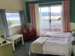 Postel nebo postele na pokoji v ubytování Lagoona Inn