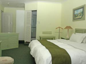 Postel nebo postele na pokoji v ubytování Lagoona Inn