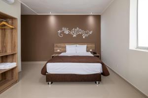 Tempat tidur dalam kamar di Hotel Solec Piura