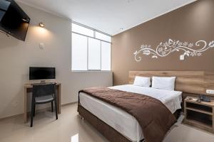 Tempat tidur dalam kamar di Hotel Solec Piura
