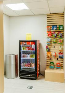 a refrigerator filled with food in a room at Holiday Inn Express Hotel & Suites Greenville, an IHG Hotel in Greenville