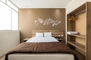 Tempat tidur dalam kamar di Hotel Solec Piura
