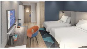 Holiday Inn Express Urumqi Station by IHG客房内的一张或多张床位