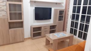 TV a/nebo společenská místnost v ubytování Casa Herrera