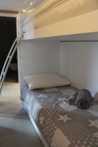 a white bunk bed in a room at Casa Coltura in Bormio