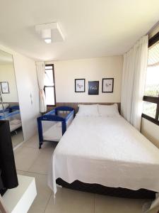 Un pat sau paturi într-o cameră la Mandara Lanai Porto das Dunas
