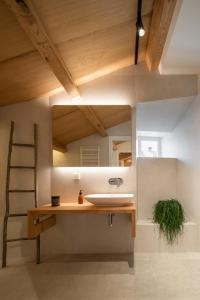 a bathroom with a sink and a mirror at NORO Plaza in A Coruña