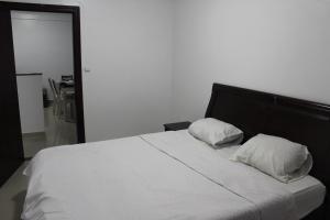 A bed or beds in a room at Residence Nadra