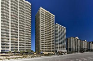 a row of tall buildings in a city at Beachfront Condo with Resort Amenities and Ocean Views in Panama City Beach