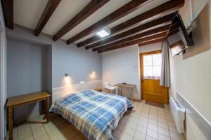 En eller flere senge i et værelse på Auberge du Tranchoir