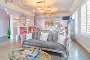 a living room with a couch and a table at Henrosa Hotel in Miami Beach