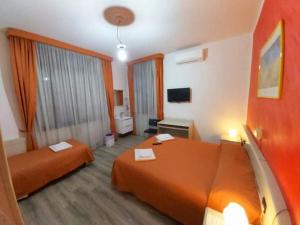 Postel nebo postele na pokoji v ubytování Hotel Arcella