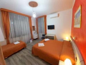 Postel nebo postele na pokoji v ubytování Hotel Arcella