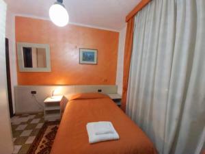 Postel nebo postele na pokoji v ubytování Hotel Arcella
