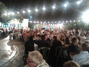 a large crowd of people sitting at tables in a restaurant at Sitanos Anna House in Sítanos