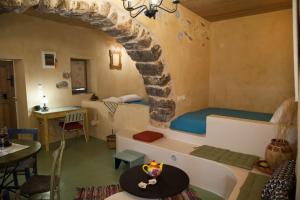 a room with a bed and a table in a room at Sitanos Anna House in Sítanos +44 photos