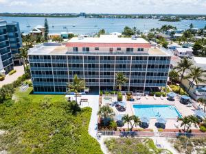 an aerial view of the resort with the ocean in the background at Windward Passage in Fort Myers Beach