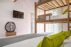 Ένα ή περισσότερα κρεβάτια σε δωμάτιο στο Hotel Boutique Laureles Home - Ayenda 1258 +18 φωτογραφίες