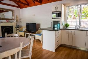 Kjøkken eller kjøkkenkrok på Homewood Cottages