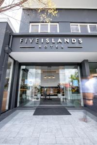 a store front with a sign that reads five islands boutique at Five Island Hotel in Cringila