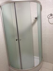 a shower with a glass door in a bathroom at Hotel San Sebastián Loja in Loja