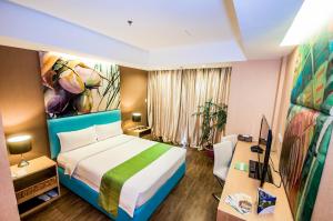 Postel nebo postele na pokoji v ubytování Aziza Paradise Hotel