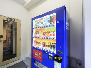 a vending machine in a building with a soda at Tamayura Hotel Asakusa in Tokyo