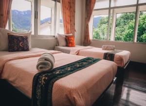 Postel nebo postele na pokoji v ubytování Thaweesuk Heritage Homestay + 37 fotografií