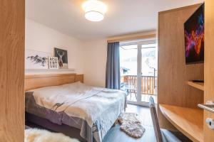 Posteľ alebo postele v izbe v ubytovaní Chalet Dorf Wagrain Alpenleben by AlpenTravel