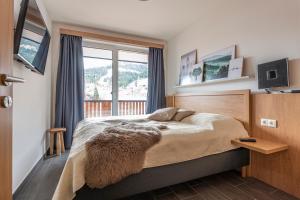 Posteľ alebo postele v izbe v ubytovaní Chalet Dorf Wagrain Alpenleben by AlpenTravel