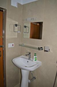 a bathroom with a sink and a mirror at Apartment in Nepal in Kathmandu