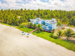 an aerial view of a house on the beach at Sollaris Ecopousada in Japaratinga
