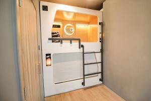 a small room with a staircase in a house at The Nap Mong Kok in Hong Kong