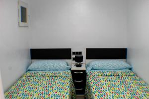 Ένα ή περισσότερα κρεβάτια σε δωμάτιο στο LOS RANCHOS PREMIUM Levante Beach