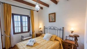 Posteľ alebo postele v izbe v ubytovaní Casa La Encina Alora by Ruralidays