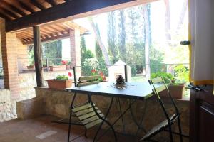 a table and two chairs on a patio at Borgo Santinovo in Colle di Val d'Elsa