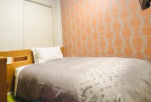 Cama o camas de una habitación en Urban Place Inn Kokura