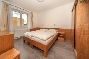 Postel nebo postele na pokoji v ubytování Hotel Panský dům