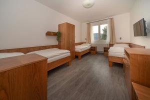Postel nebo postele na pokoji v ubytování Hotel Panský dům