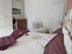 A bed or beds in a room at La Casetta - Near the sea & free parking