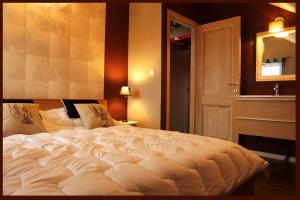 Gîte Pause Nature Saint-Hubert客房内的一张或多张床位
